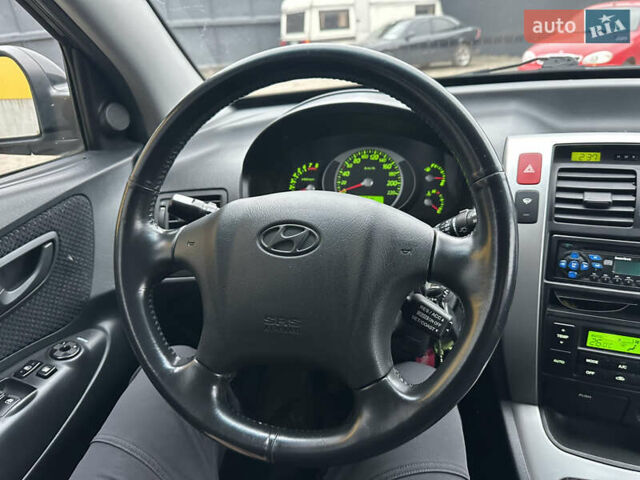 Чорний Хендай Туксон, об'ємом двигуна 2 л та пробігом 243 тис. км за 7999 $, фото 33 на Automoto.ua