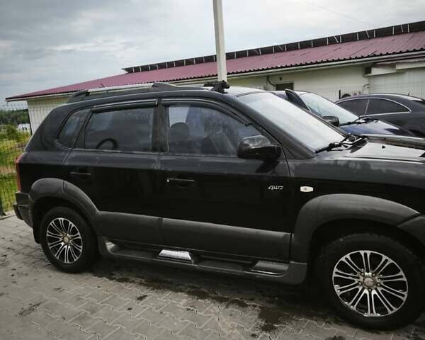 Черный Хендай Туксон, объемом двигателя 1.98 л и пробегом 189 тыс. км за 7800 $, фото 18 на Automoto.ua