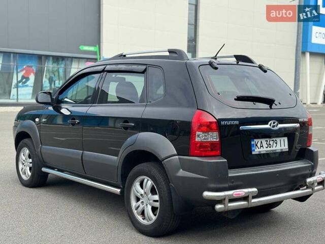 Черный Хендай Туксон, объемом двигателя 1.98 л и пробегом 202 тыс. км за 8350 $, фото 7 на Automoto.ua