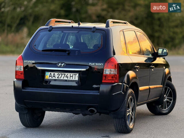 Черный Хендай Туксон, объемом двигателя 2 л и пробегом 250 тыс. км за 7600 $, фото 10 на Automoto.ua