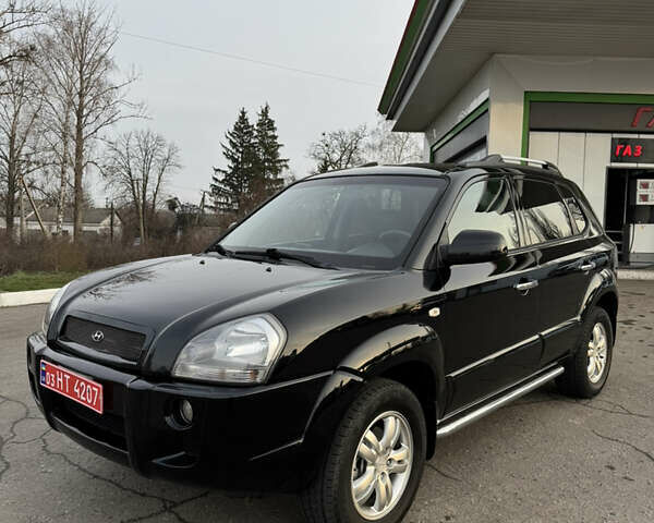 Черный Хендай Туксон, объемом двигателя 2 л и пробегом 210 тыс. км за 7850 $, фото 9 на Automoto.ua