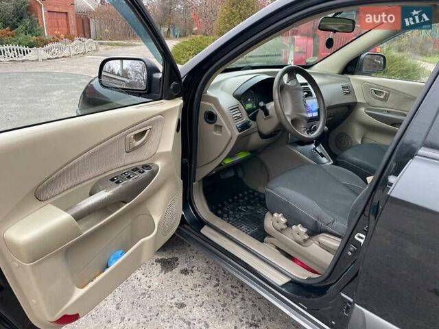 Черный Хендай Туксон, объемом двигателя 1.98 л и пробегом 290 тыс. км за 7000 $, фото 10 на Automoto.ua