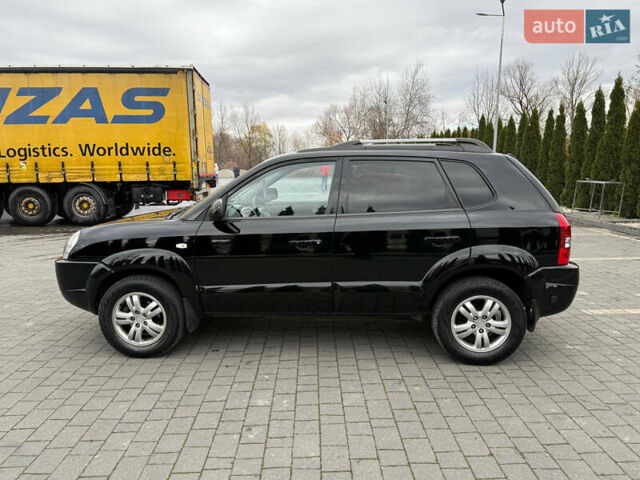Черный Хендай Туксон, объемом двигателя 1.98 л и пробегом 205 тыс. км за 7950 $, фото 7 на Automoto.ua