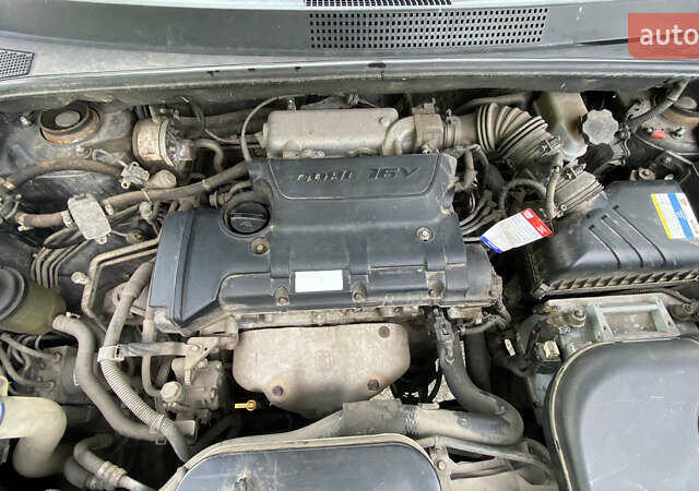 Чорний Хендай Туксон, об'ємом двигуна 2 л та пробігом 201 тис. км за 7800 $, фото 10 на Automoto.ua