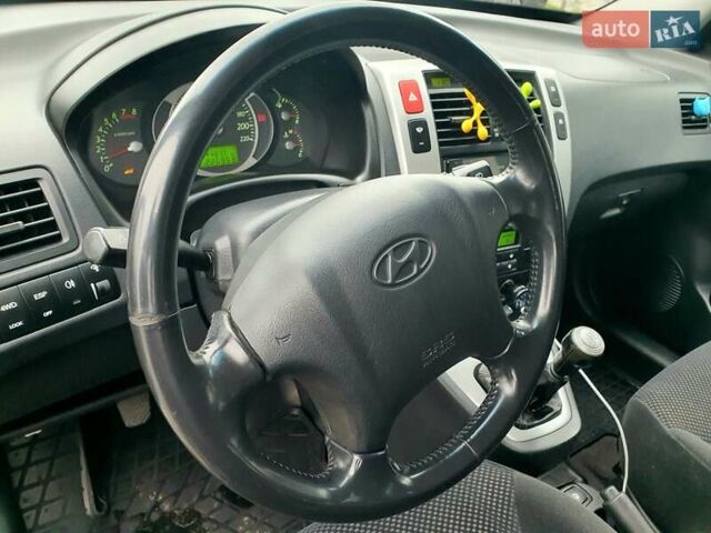Чорний Хендай Туксон, об'ємом двигуна 2 л та пробігом 225 тис. км за 8000 $, фото 44 на Automoto.ua