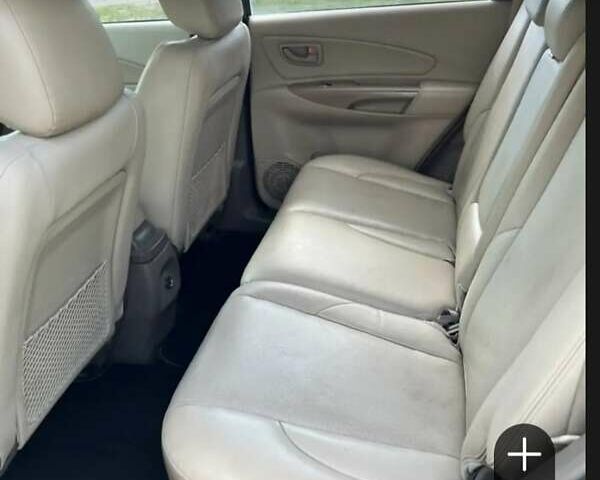 Черный Хендай Туксон, объемом двигателя 1.98 л и пробегом 300 тыс. км за 6800 $, фото 3 на Automoto.ua