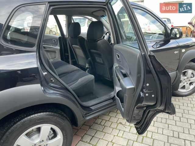 Черный Хендай Туксон, объемом двигателя 1.98 л и пробегом 177 тыс. км за 7600 $, фото 23 на Automoto.ua