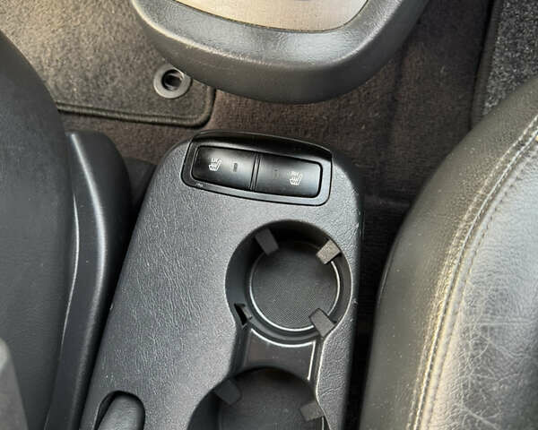 Черный Хендай Туксон, объемом двигателя 2 л и пробегом 210 тыс. км за 7850 $, фото 33 на Automoto.ua