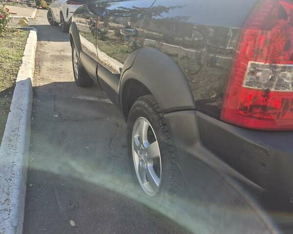 Черный Хендай Туксон, объемом двигателя 1.98 л и пробегом 93 тыс. км за 11800 $, фото 4 на Automoto.ua