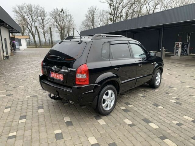 Черный Хендай Туксон, объемом двигателя 2 л и пробегом 198 тыс. км за 7500 $, фото 1 на Automoto.ua