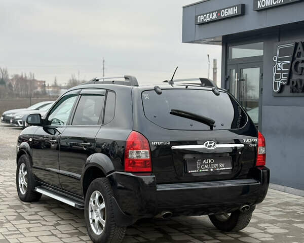 Чорний Хендай Туксон, об'ємом двигуна 2 л та пробігом 240 тис. км за 6888 $, фото 11 на Automoto.ua