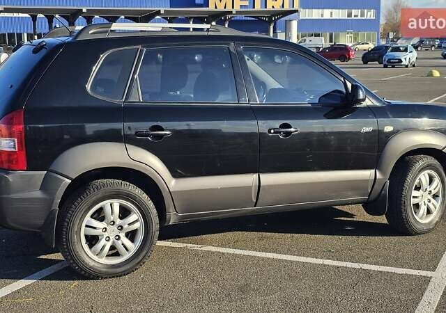 Чорний Хендай Туксон, об'ємом двигуна 1.98 л та пробігом 212 тис. км за 7766 $, фото 6 на Automoto.ua