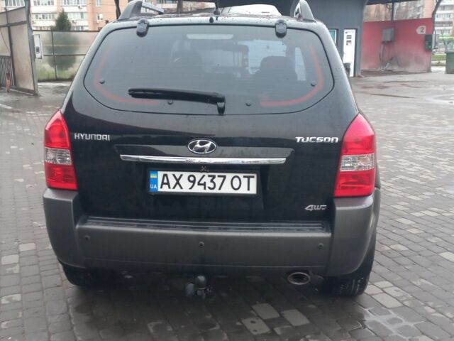 Черный Хендай Туксон, объемом двигателя 2 л и пробегом 200 тыс. км за 8300 $, фото 4 на Automoto.ua