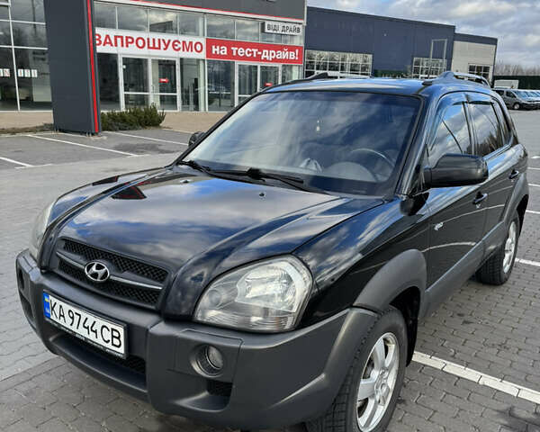 Чорний Хендай Туксон, об'ємом двигуна 1.98 л та пробігом 318 тис. км за 7399 $, фото 4 на Automoto.ua
