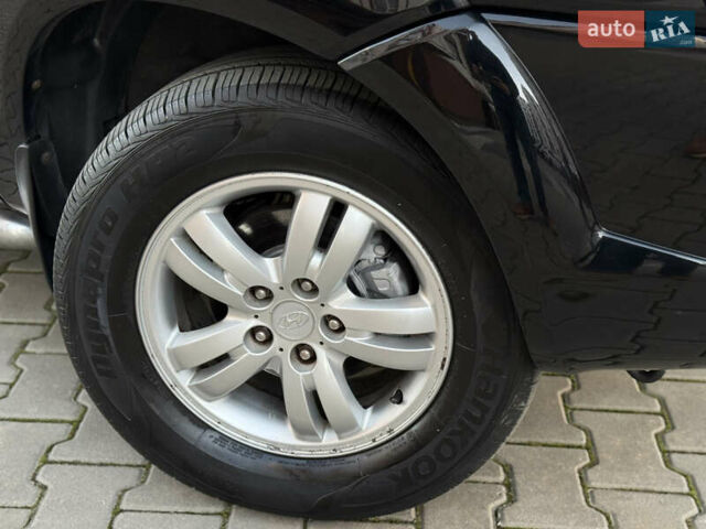 Чорний Хендай Туксон, об'ємом двигуна 2 л та пробігом 156 тис. км за 7850 $, фото 45 на Automoto.ua
