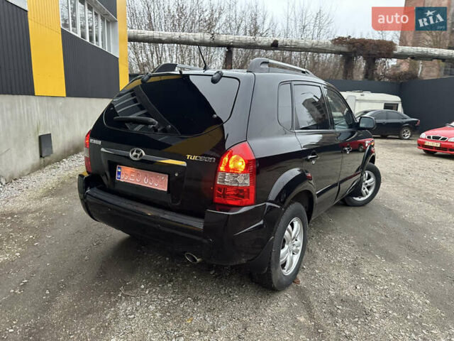 Чорний Хендай Туксон, об'ємом двигуна 2 л та пробігом 243 тис. км за 7999 $, фото 18 на Automoto.ua