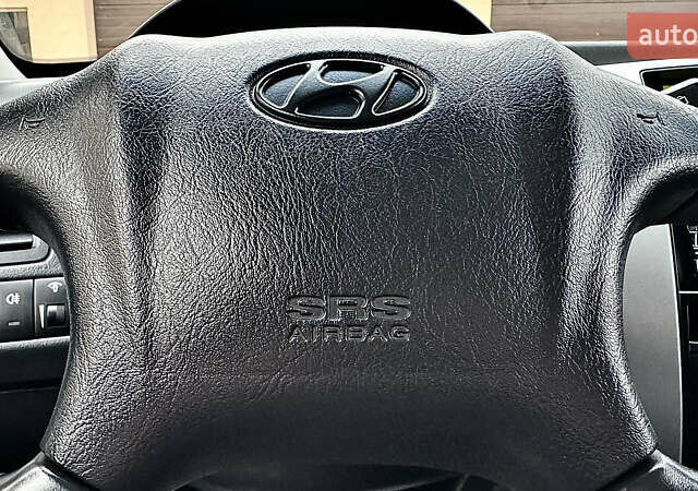 Чорний Хендай Туксон, об'ємом двигуна 2 л та пробігом 182 тис. км за 8299 $, фото 65 на Automoto.ua