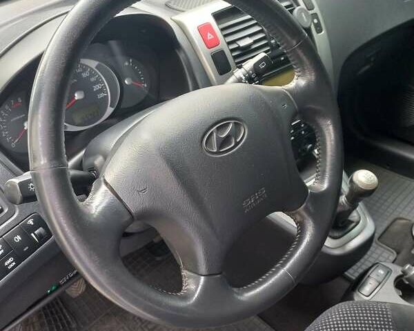 Черный Хендай Туксон, объемом двигателя 2 л и пробегом 168 тыс. км за 9000 $, фото 24 на Automoto.ua