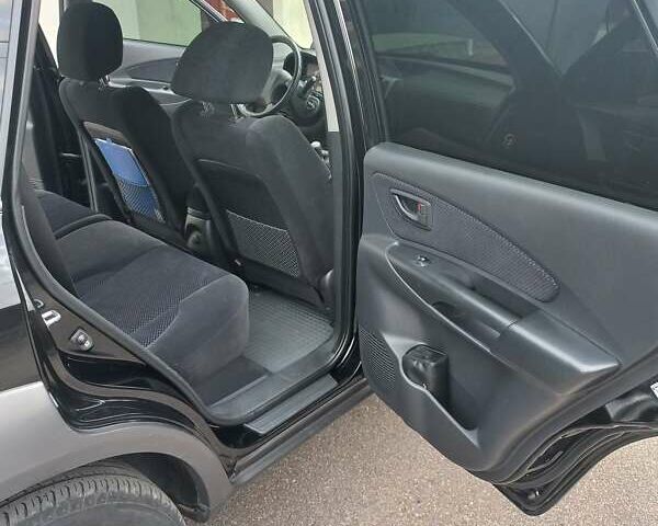 Черный Хендай Туксон, объемом двигателя 2 л и пробегом 168 тыс. км за 9000 $, фото 46 на Automoto.ua