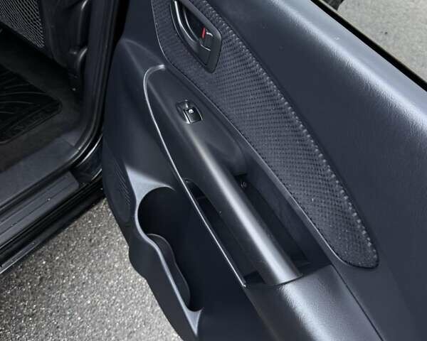 Черный Хендай Туксон, объемом двигателя 2 л и пробегом 253 тыс. км за 8299 $, фото 13 на Automoto.ua