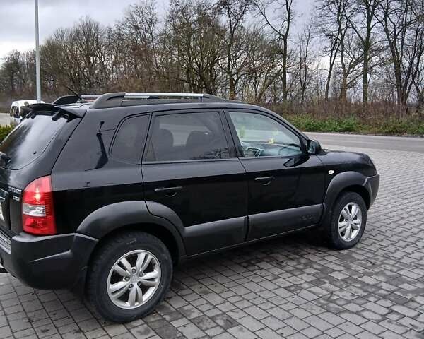 Черный Хендай Туксон, объемом двигателя 2 л и пробегом 230 тыс. км за 8000 $, фото 12 на Automoto.ua