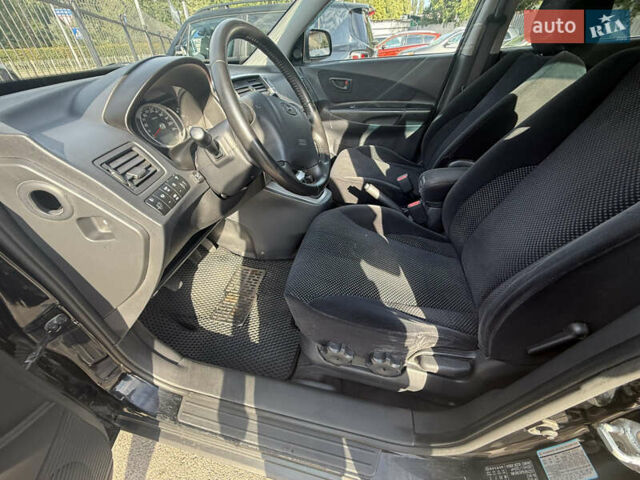 Черный Хендай Туксон, объемом двигателя 2 л и пробегом 218 тыс. км за 6700 $, фото 8 на Automoto.ua