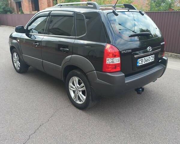 Черный Хендай Туксон, объемом двигателя 2 л и пробегом 168 тыс. км за 9000 $, фото 10 на Automoto.ua