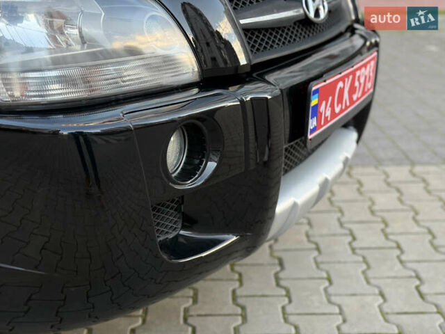 Чорний Хендай Туксон, об'ємом двигуна 2 л та пробігом 156 тис. км за 7850 $, фото 44 на Automoto.ua