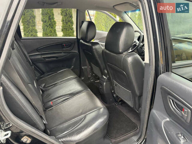 Черный Хендай Туксон, объемом двигателя 1.98 л и пробегом 205 тыс. км за 7950 $, фото 12 на Automoto.ua