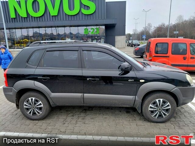 Чорний Хендай Туксон, об'ємом двигуна 2 л та пробігом 106 тис. км за 8350 $, фото 1 на Automoto.ua