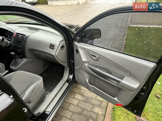 Черный Хендай Туксон, объемом двигателя 2 л и пробегом 107 тыс. км за 8900 $, фото 30 на Automoto.ua