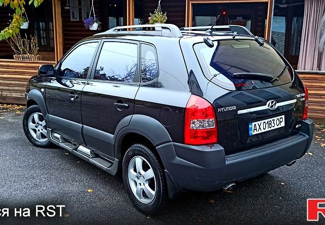 Чорний Хендай Туксон, об'ємом двигуна 2 л та пробігом 188 тис. км за 8800 $, фото 2 на Automoto.ua