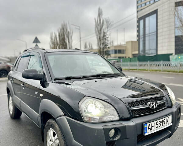 Чорний Хендай Туксон, об'ємом двигуна 1.98 л та пробігом 238 тис. км за 8499 $, фото 1 на Automoto.ua