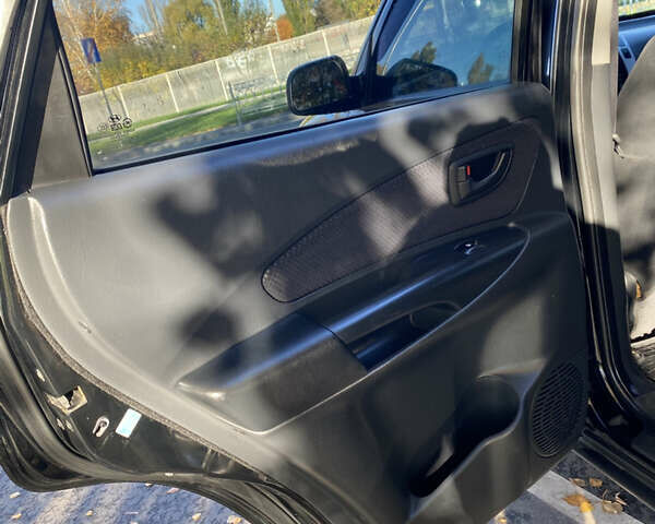 Черный Хендай Туксон, объемом двигателя 1.98 л и пробегом 218 тыс. км за 7200 $, фото 15 на Automoto.ua