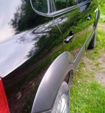 Черный Хендай Туксон, объемом двигателя 1.98 л и пробегом 200 тыс. км за 6600 $, фото 4 на Automoto.ua