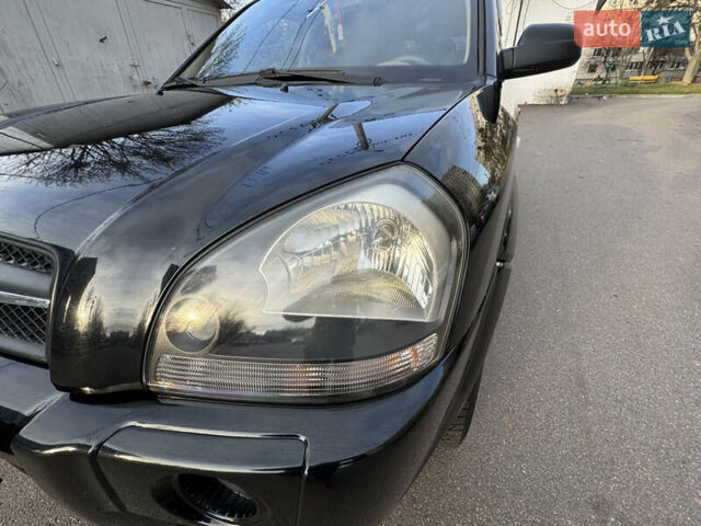 Черный Хендай Туксон, объемом двигателя 1.98 л и пробегом 196 тыс. км за 7999 $, фото 12 на Automoto.ua