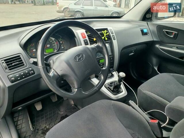 Чорний Хендай Туксон, об'ємом двигуна 2 л та пробігом 225 тис. км за 8000 $, фото 42 на Automoto.ua