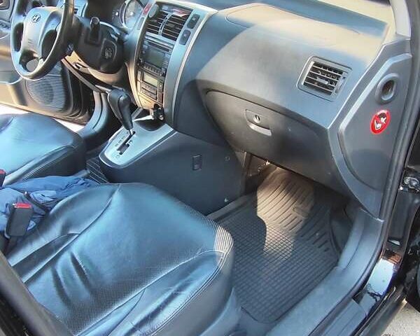 Черный Хендай Туксон, объемом двигателя 1.98 л и пробегом 330 тыс. км за 8200 $, фото 1 на Automoto.ua