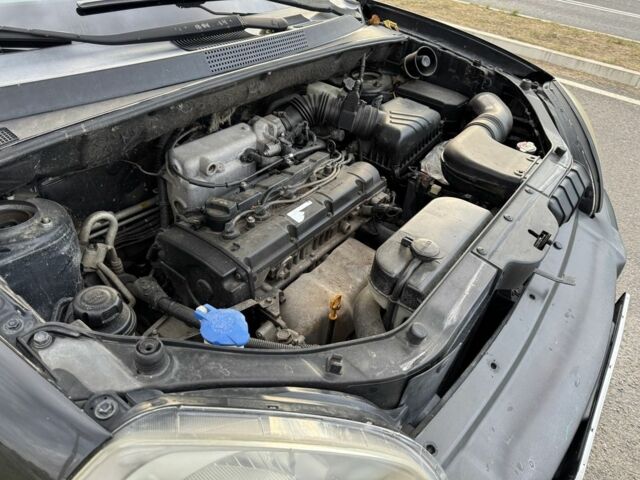 Чорний Хендай Туксон, об'ємом двигуна 2 л та пробігом 291 тис. км за 5400 $, фото 6 на Automoto.ua