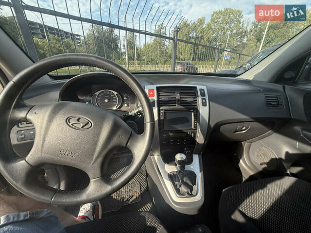 Черный Хендай Туксон, объемом двигателя 2 л и пробегом 218 тыс. км за 6700 $, фото 7 на Automoto.ua