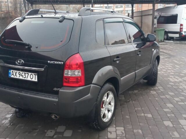 Черный Хендай Туксон, объемом двигателя 2 л и пробегом 200 тыс. км за 8300 $, фото 6 на Automoto.ua