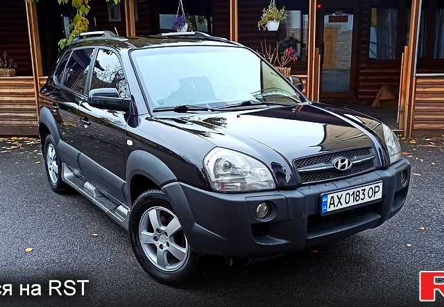 Чорний Хендай Туксон, об'ємом двигуна 2 л та пробігом 188 тис. км за 8800 $, фото 5 на Automoto.ua