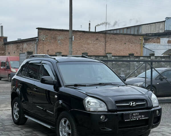 Чорний Хендай Туксон, об'ємом двигуна 2 л та пробігом 240 тис. км за 6888 $, фото 6 на Automoto.ua