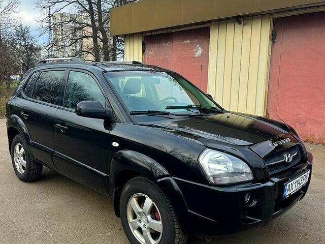 Черный Хендай Туксон, объемом двигателя 2 л и пробегом 215 тыс. км за 6700 $, фото 6 на Automoto.ua