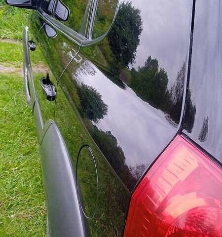 Черный Хендай Туксон, объемом двигателя 1.98 л и пробегом 200 тыс. км за 6600 $, фото 3 на Automoto.ua