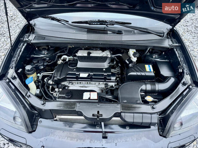 Черный Хендай Туксон, объемом двигателя 1.98 л и пробегом 96 тыс. км за 9900 $, фото 7 на Automoto.ua