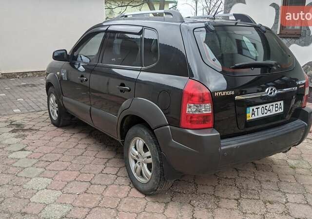 Черный Хендай Туксон, объемом двигателя 2 л и пробегом 163 тыс. км за 8100 $, фото 25 на Automoto.ua