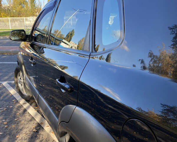 Черный Хендай Туксон, объемом двигателя 1.98 л и пробегом 218 тыс. км за 7200 $, фото 25 на Automoto.ua