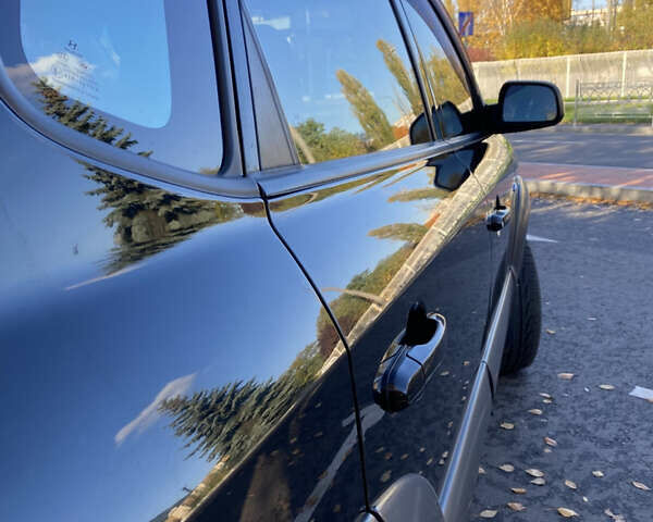 Черный Хендай Туксон, объемом двигателя 1.98 л и пробегом 218 тыс. км за 7200 $, фото 24 на Automoto.ua