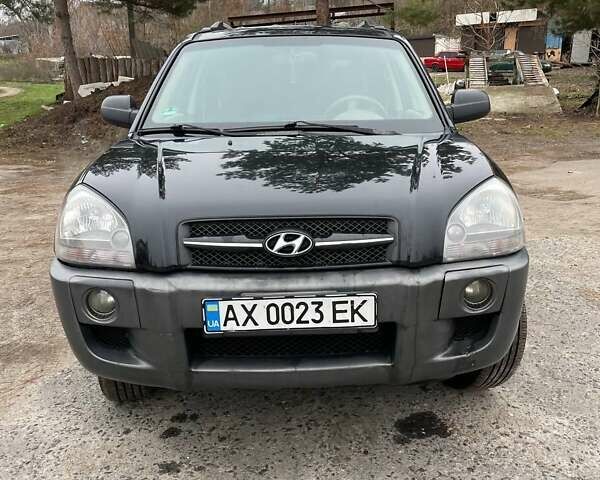 Черный Хендай Туксон, объемом двигателя 1.98 л и пробегом 290 тыс. км за 7000 $, фото 9 на Automoto.ua